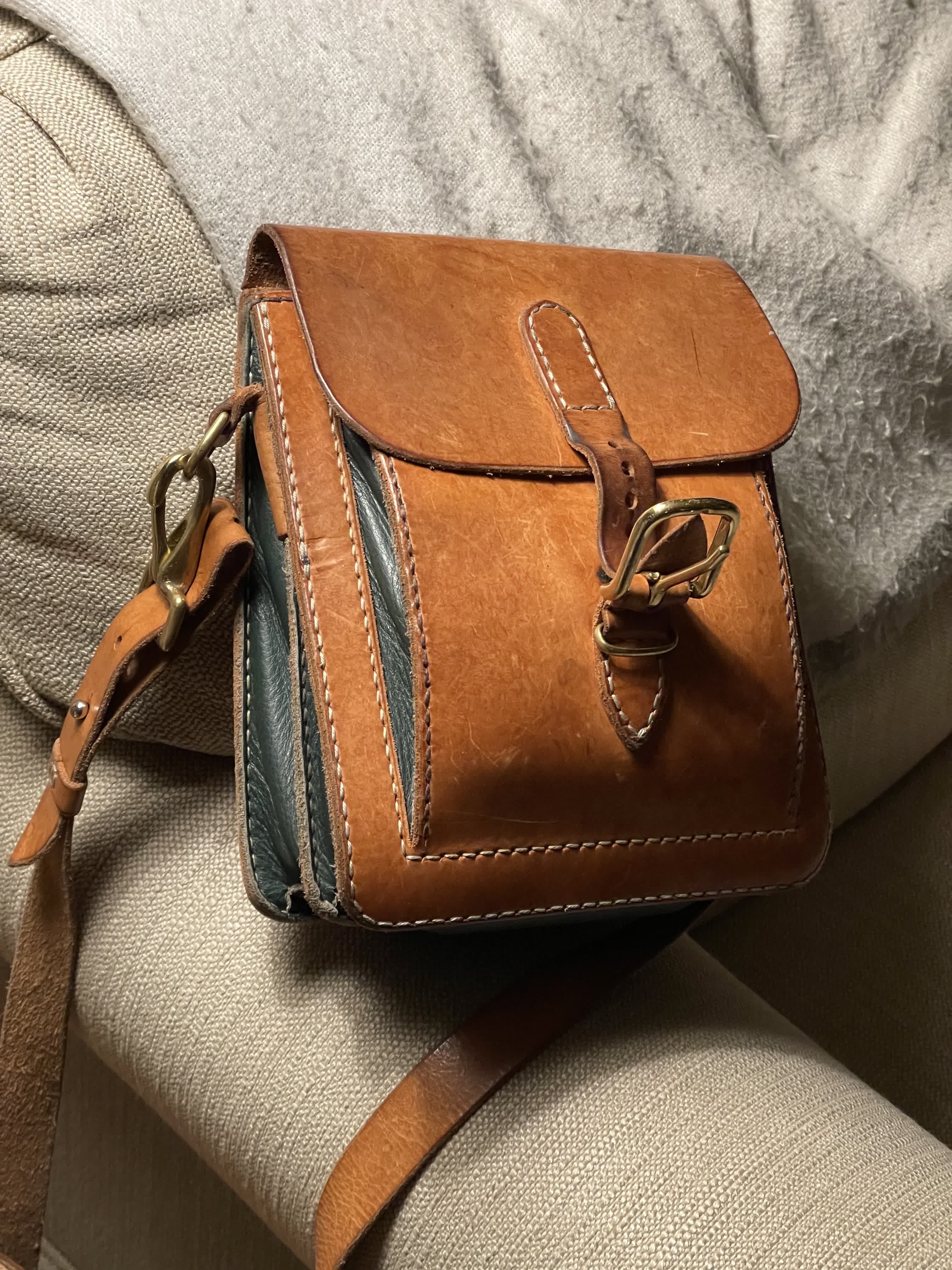 Close-up of the satchel side and flap construction.