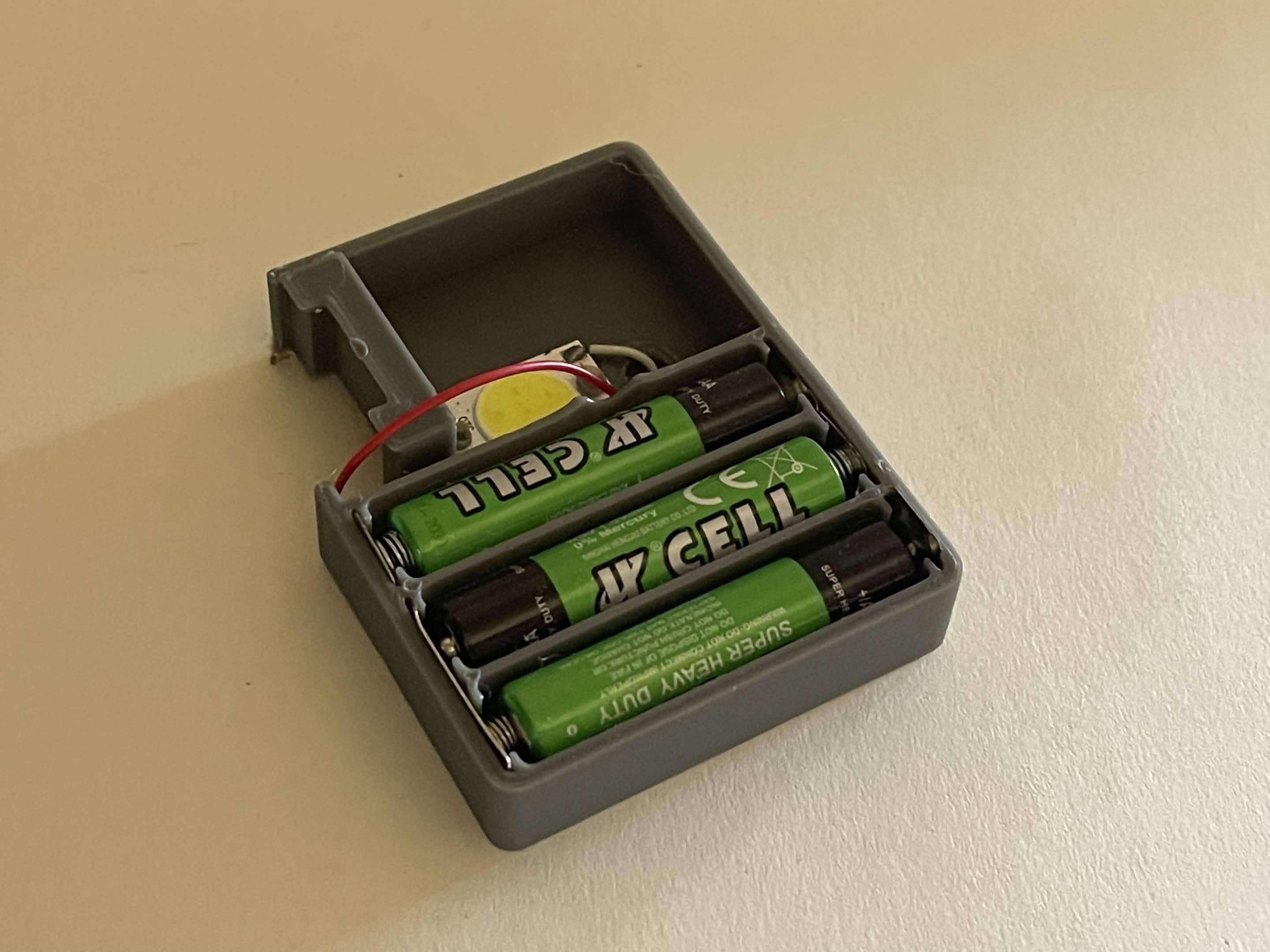 Interior of the completed pager belt box showing battery tray and lighting housing.